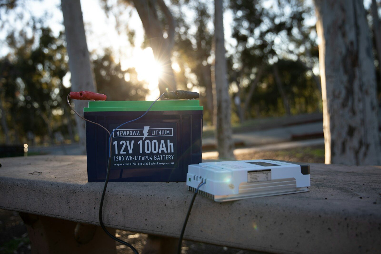 a small device sitting on top of a cement bench